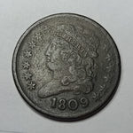 Vintage coin with a portrait and '1809' on a white background