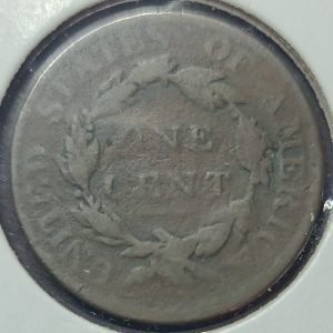 Close-up of a U.S. cent coin with 'Liberty' and 'E Pluribus Unum' inscriptions.
