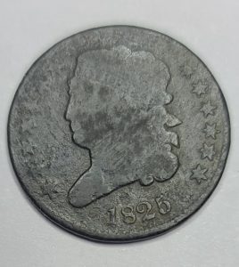 Old coin with a profile silhouette and '1825' marking on a gray background