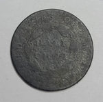Old coin with intricate design on a gray background