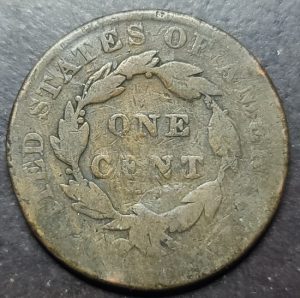Vintage American cent coin on a dark background