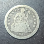 Vintage silver coin with a portrait and '1841' on a dark background