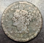 Vintage coin with a profile of a person and star patterns on a textured surface