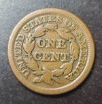 Bronze U.S. cent coin on a dark background