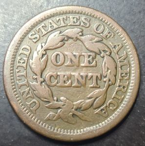 One cent coin from the United States on a dark background
