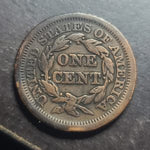Vintage U.S. one cent coin on a dark background