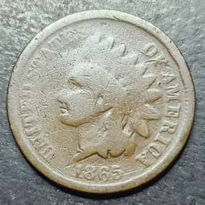 Vintage Indian Head cent coin from 1865 on a dark background