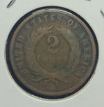 Two-cent piece coin from the United States on a white background