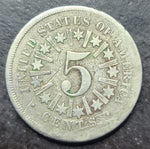 Five-cent piece coin from the United States on a dark background