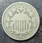 A close up of an 1868 shield nickel 