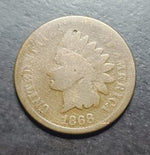Vintage Indian Head penny on a dark surface