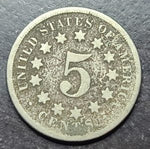Five-cent piece coin from the United States on a dark background