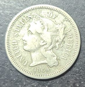 Close up of a 3 cent nickel