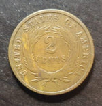 Two-cent piece coin from the United States on a dark background