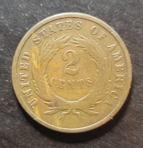 Two-cent piece coin from the United States on a dark background