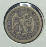 Silver coin with an eagle emblem and 'United States of America' text on a white background