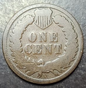 Vintage one cent coin on a textured surface