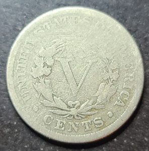 Silver five-cent piece with 'V' and 'Cents' text on a dark background