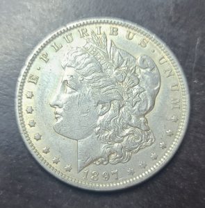 Close up view of an 1897 New Orleans mint silver dollar obverse 