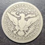 Silver quarter dollar coin with an eagle design on a dark background