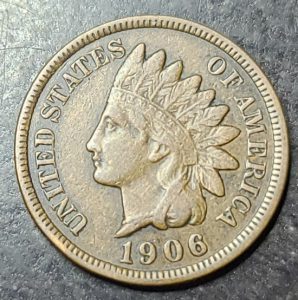 1906 Indian Head penny on a dark background