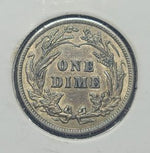Vintage one dime coin on a light gray background