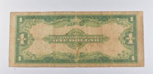 One dollar bill from the United States with a green and brown color scheme on a white background