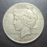 1934 Peace Dollar coin on a dark background