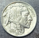 Buffalo Nickel coin with 'Liberty' inscribed on a dark background
