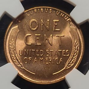 Copper penny with 'One Cent United States of America' text on a black and white background