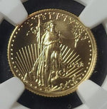 Gold coin with a personification of Liberty design held by a gloved hand.