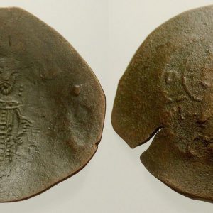 bronze coin with embossed designs on a white background