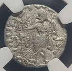 Silver coin with intricate design under a protective cover