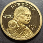Gold-colored coin with a portrait and 'Liberty' text on a dark background