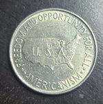 Coin with map of the United States and text on a dark background